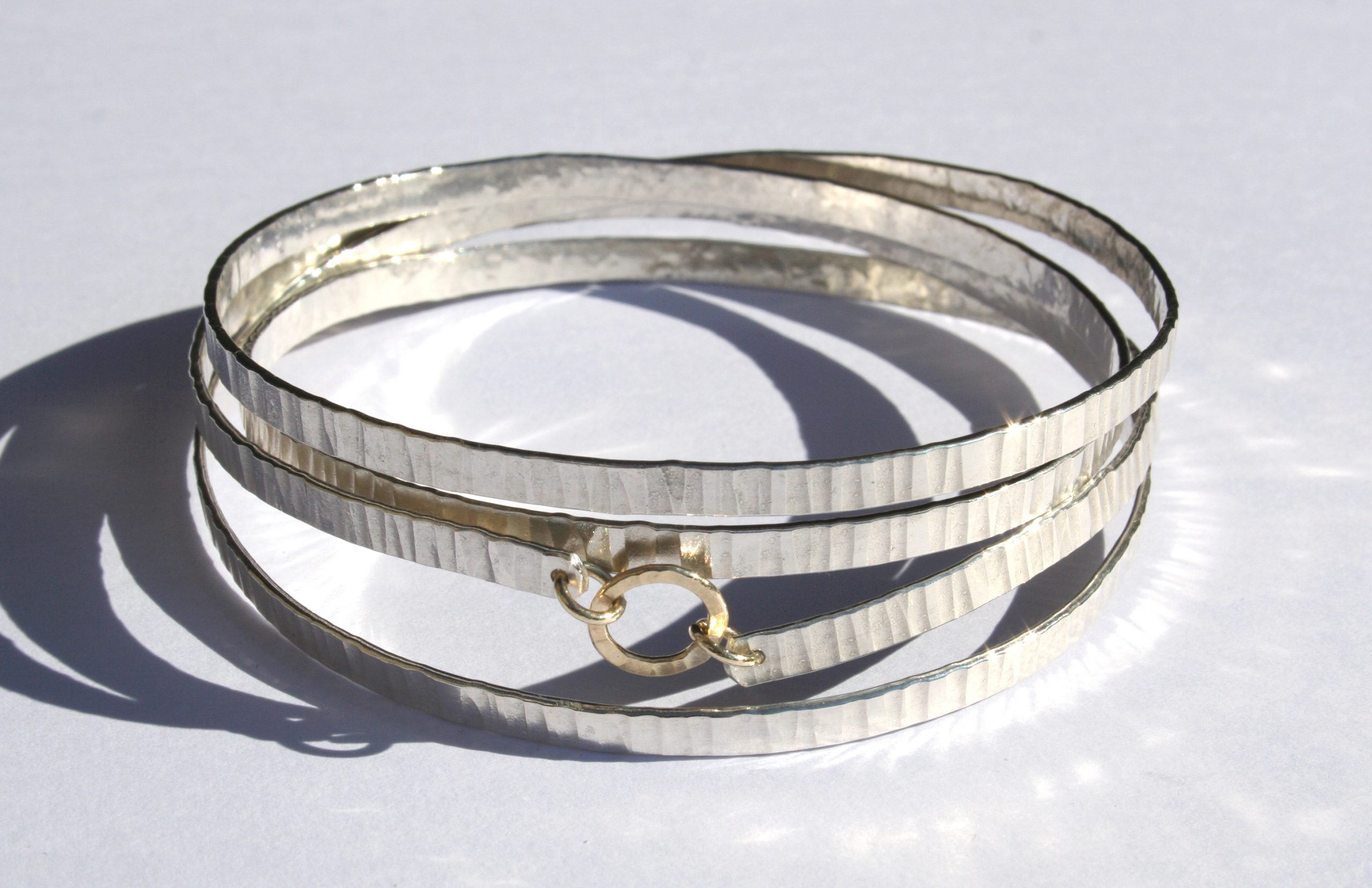 Hammered 4 spiral bangle with 9ct gold links