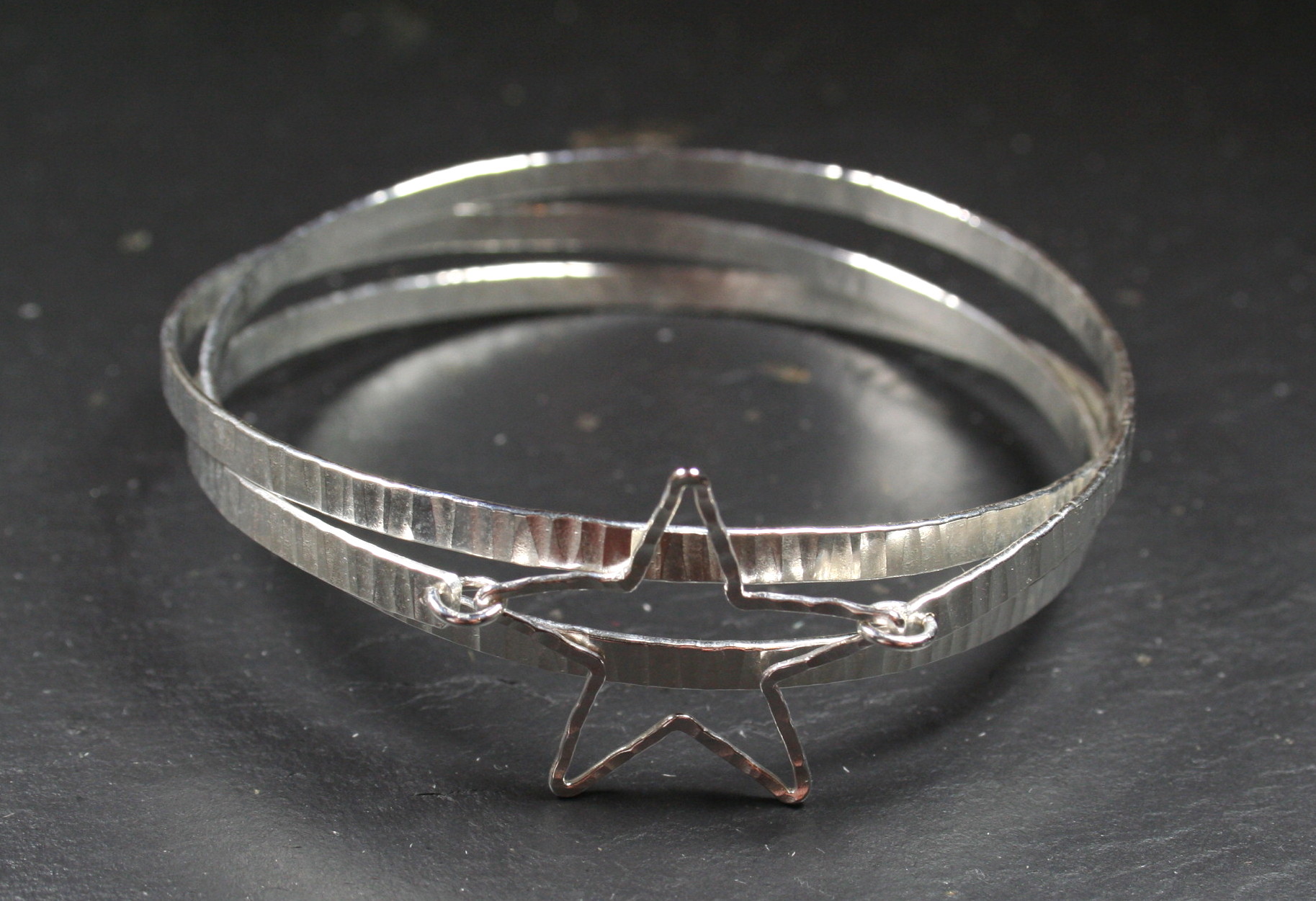 Hammered 3 spiral bangle with silver star