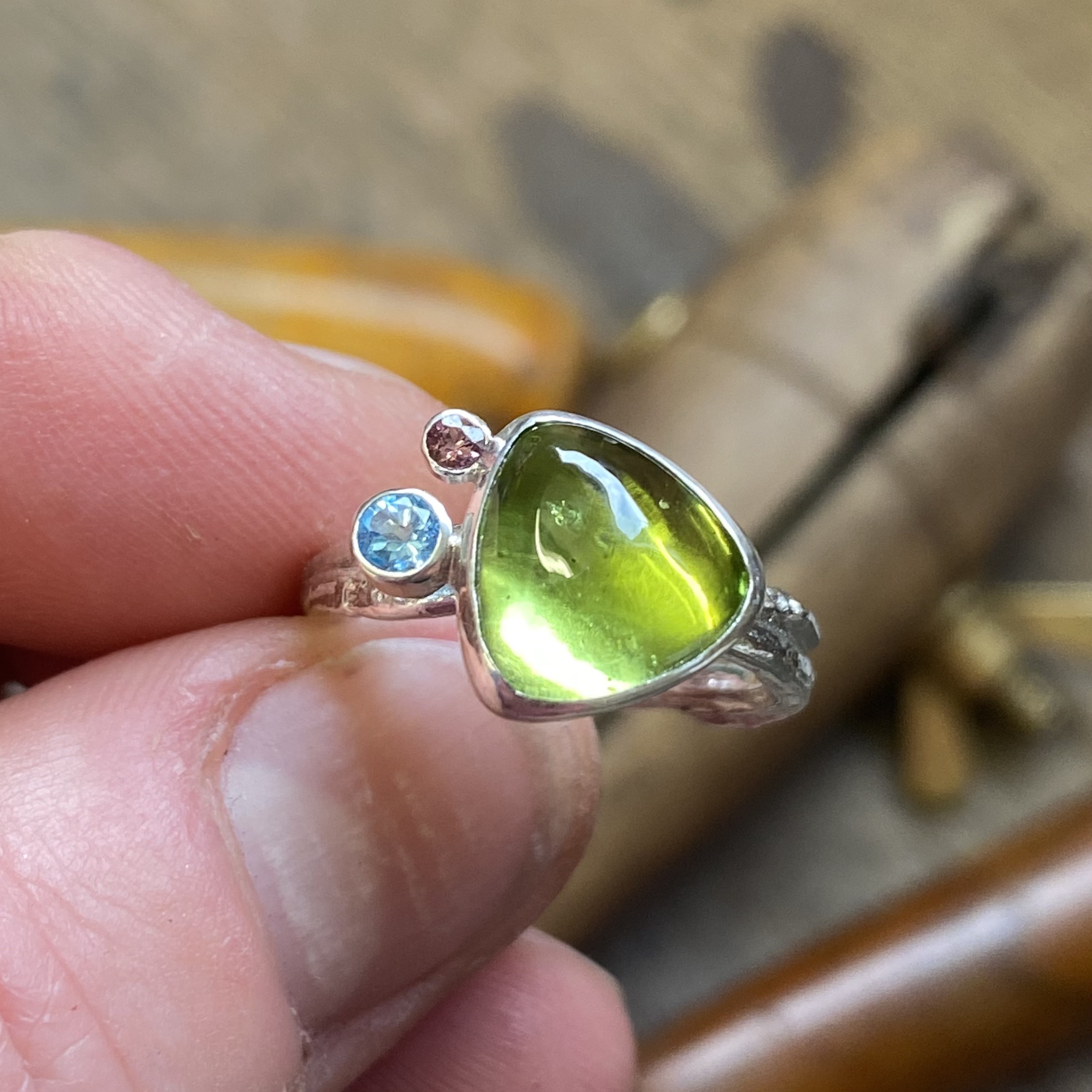 Peridot topaz and rhodolite willow ring